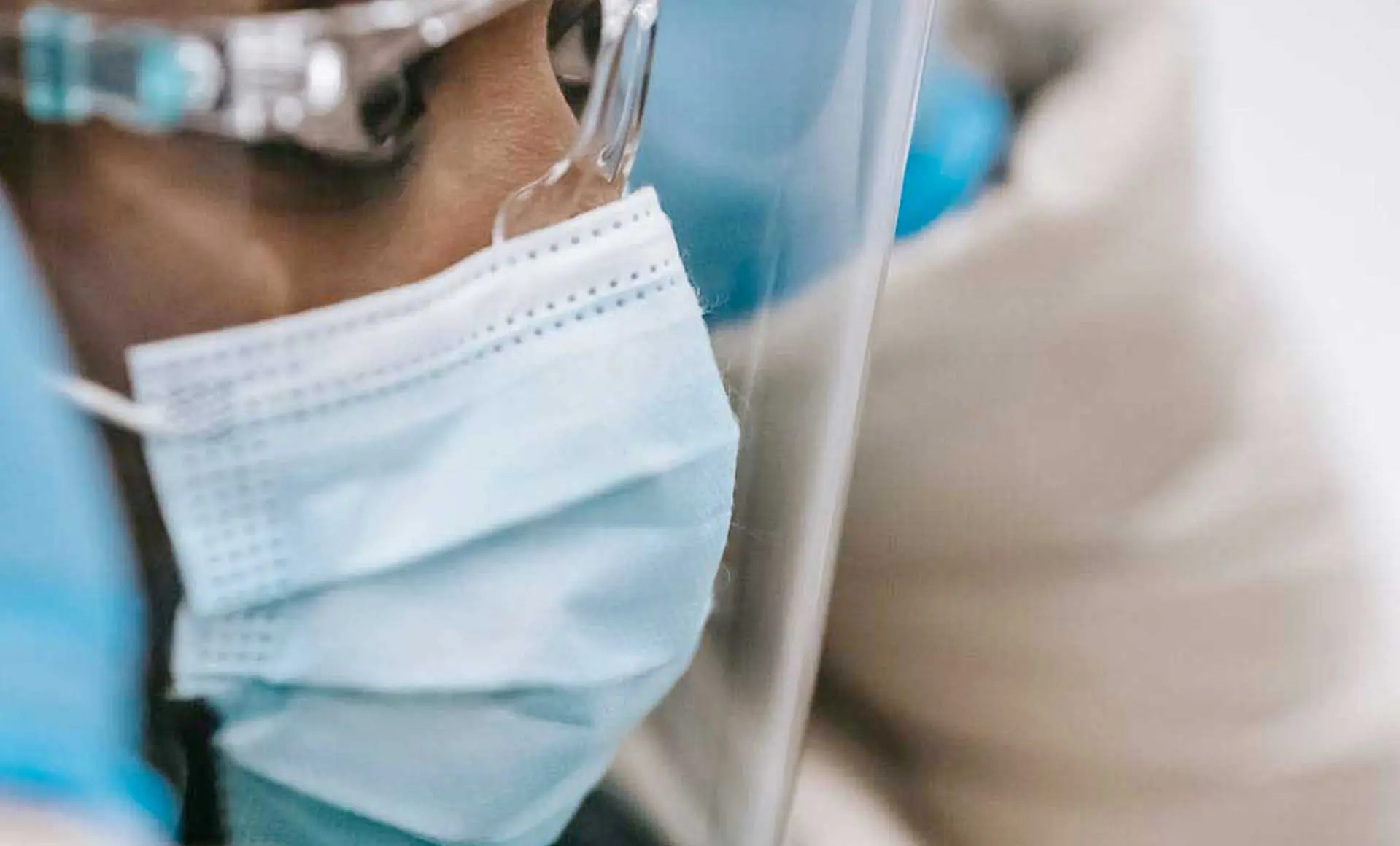 A woman wearing personal protective equipment