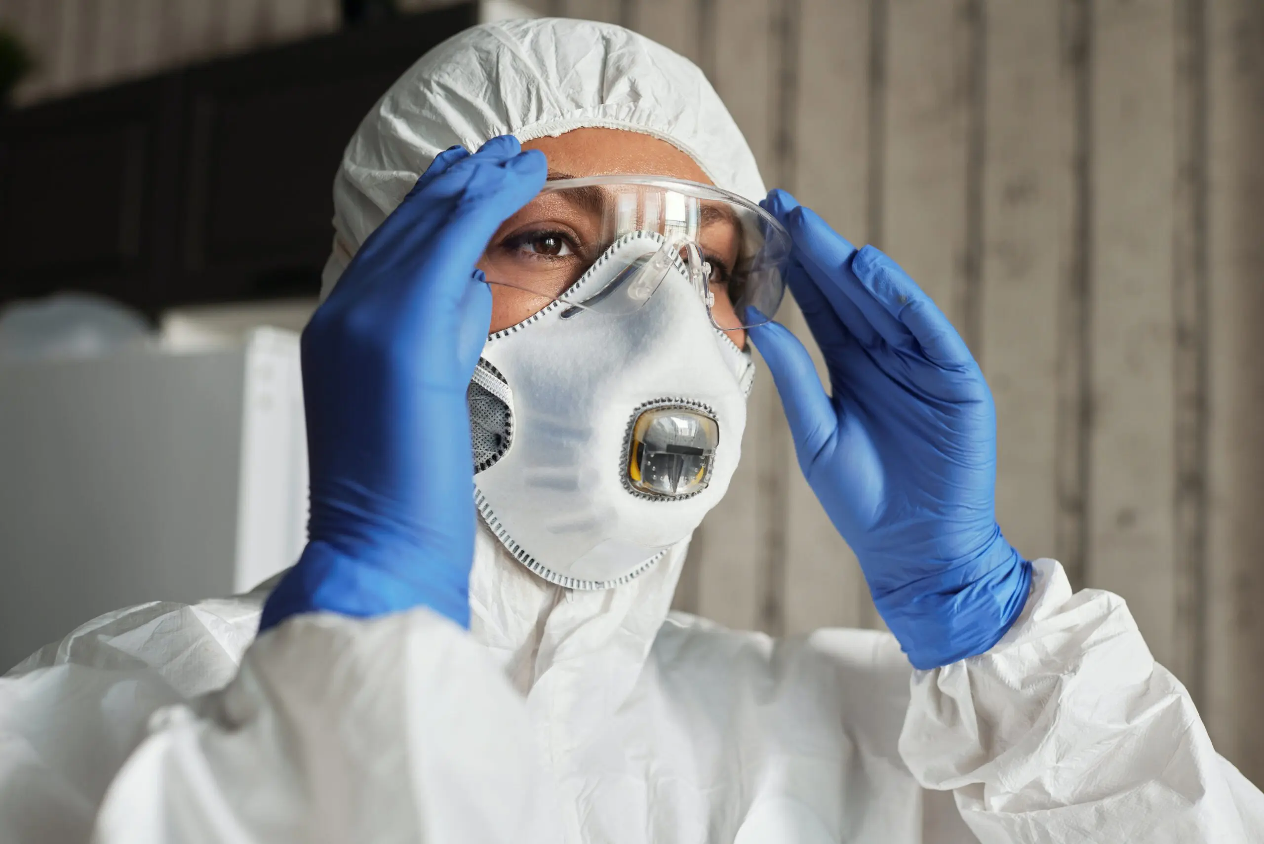 A person in full body personal protective gear