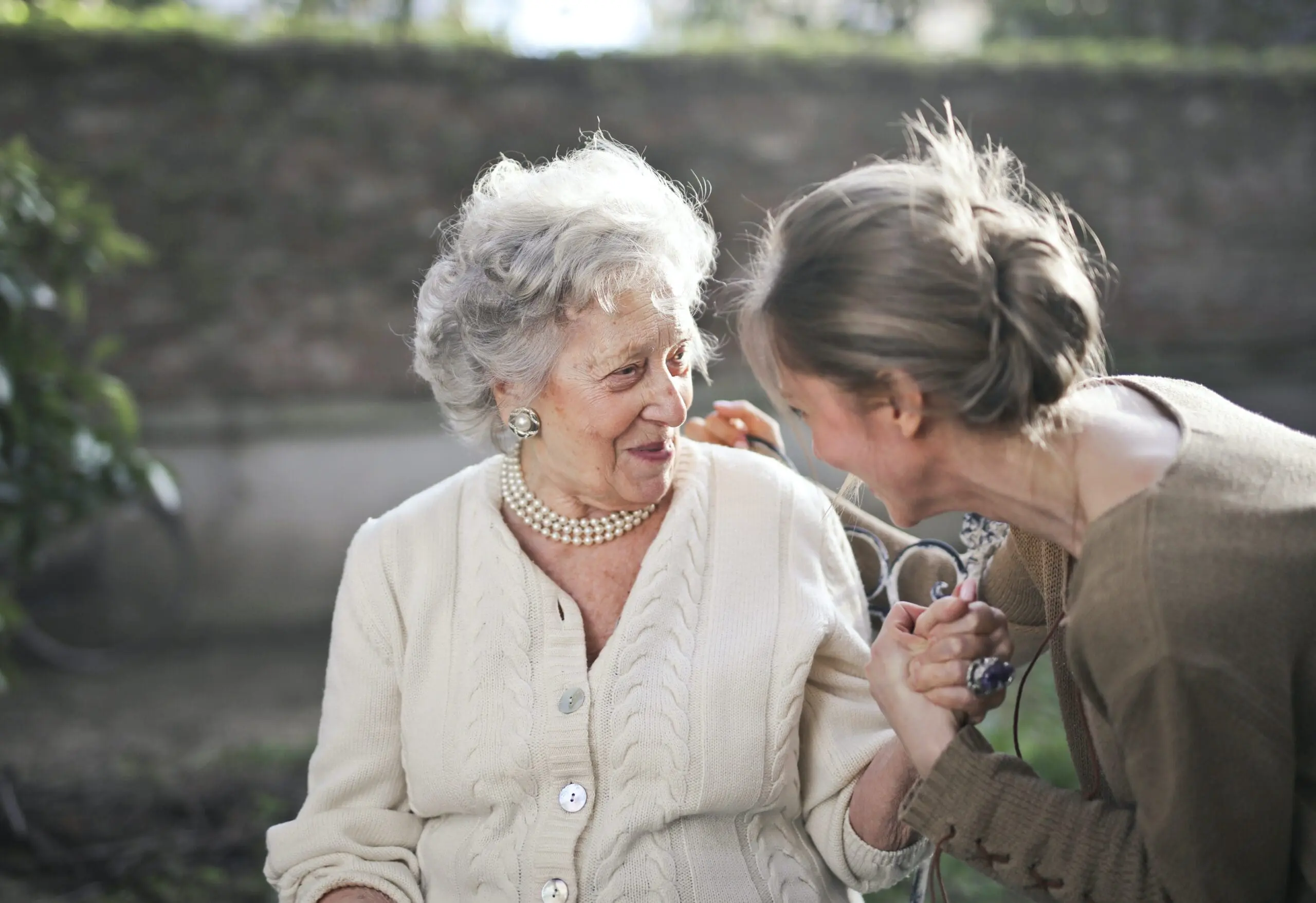 Two women with clasped hands