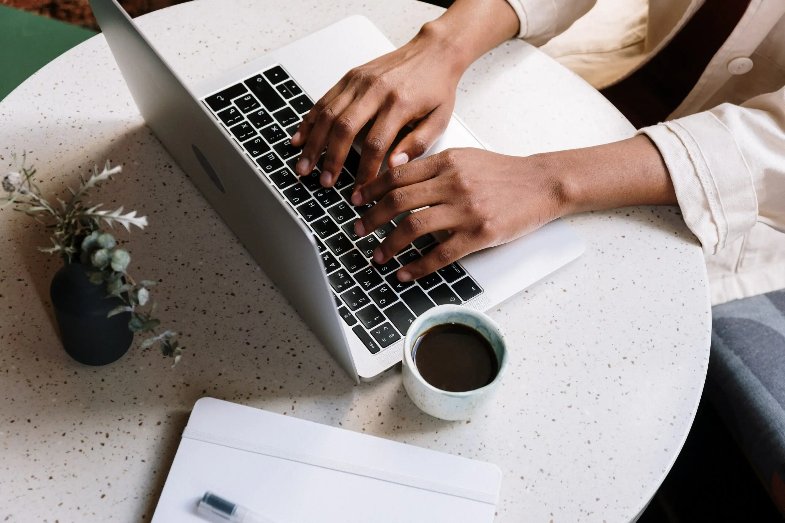 Someone typing on a laptop