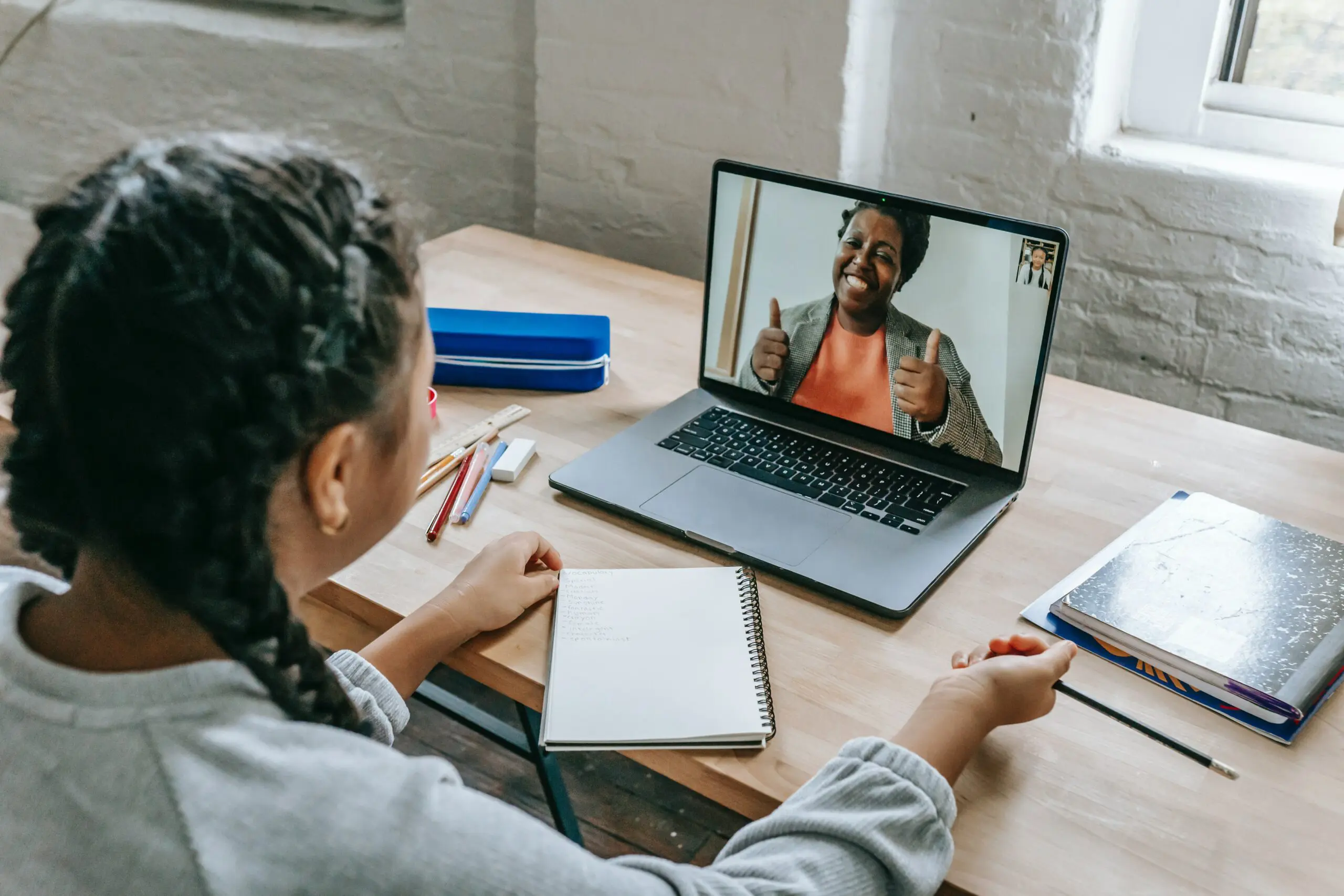 Someone using a laptop to have a video call