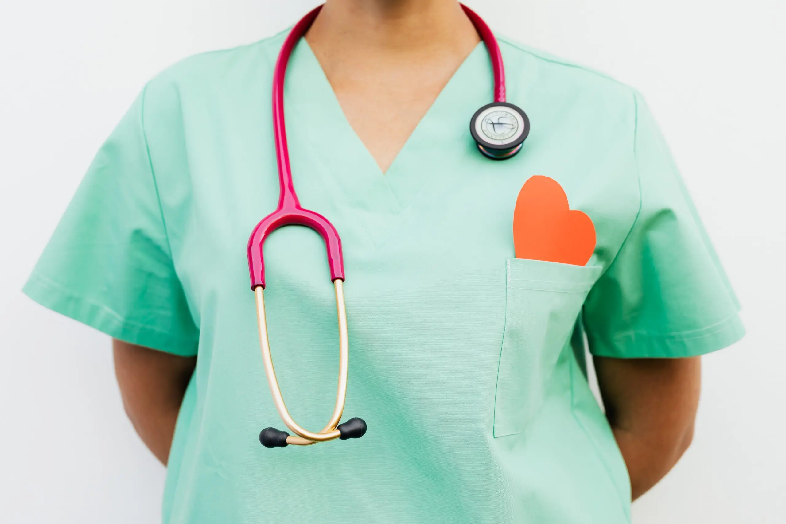 Someone in scrubs with a stethoscope around their neck
