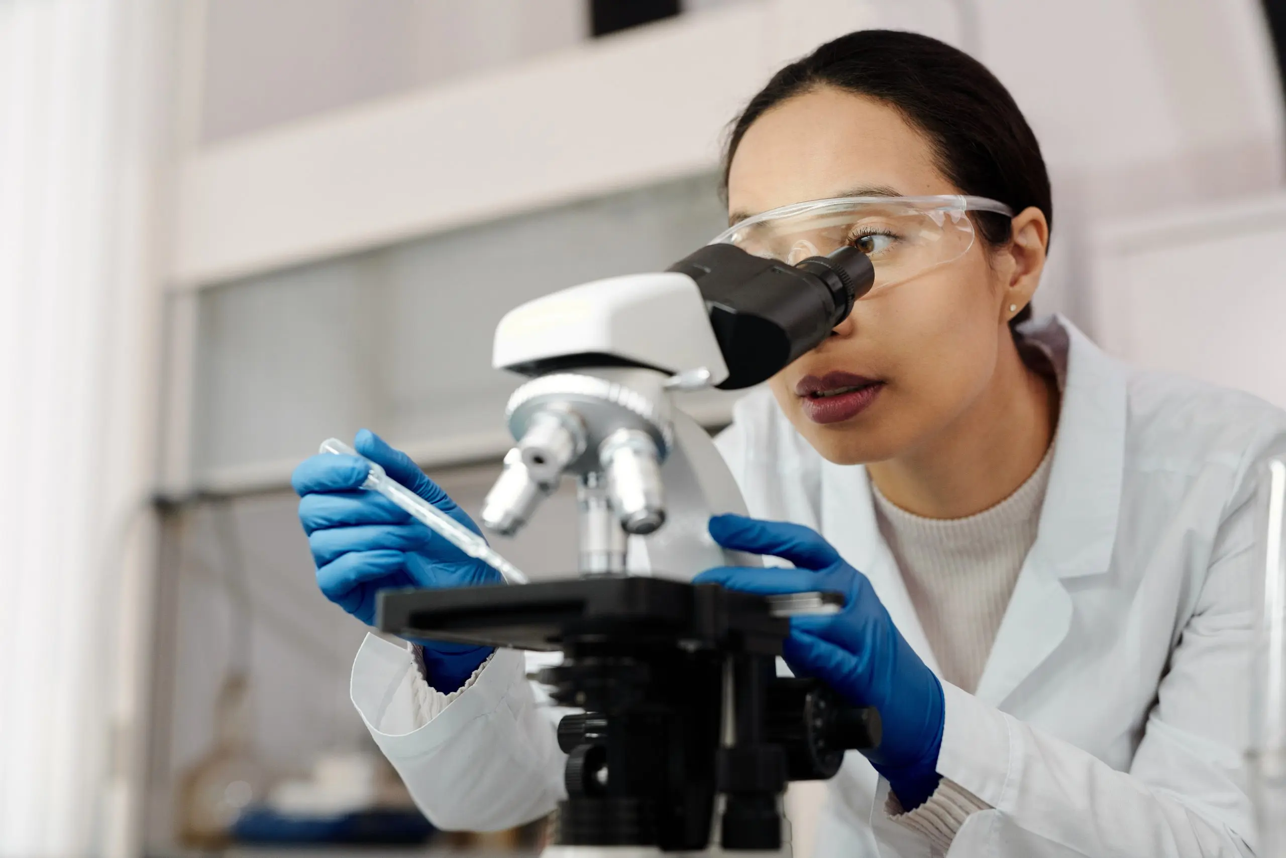 Someone using a microscope