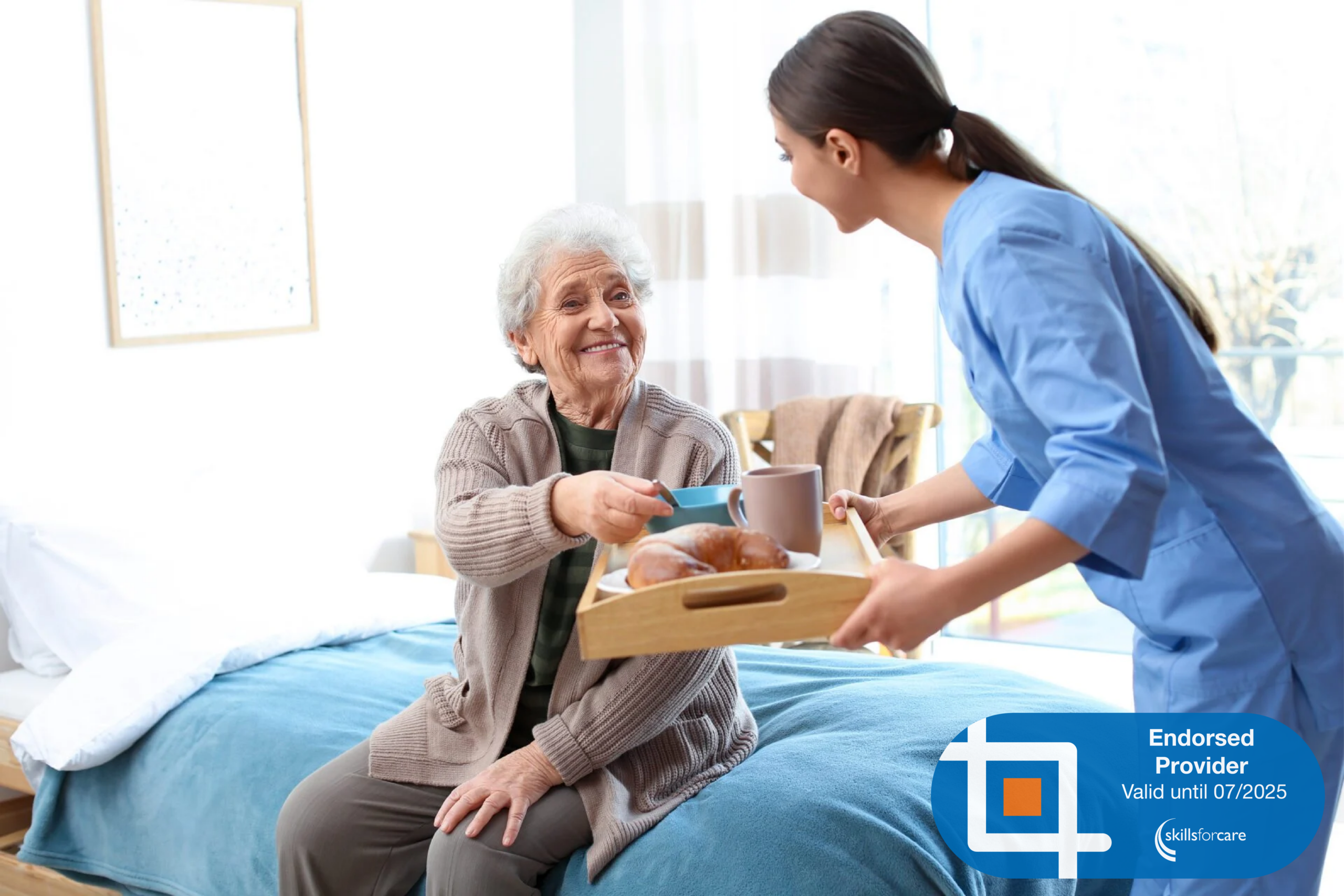7 Someone in scrubs delivering breakfast to an elderly lady. At the bottom right corner is the Skills For Care Endorsed Provider logo