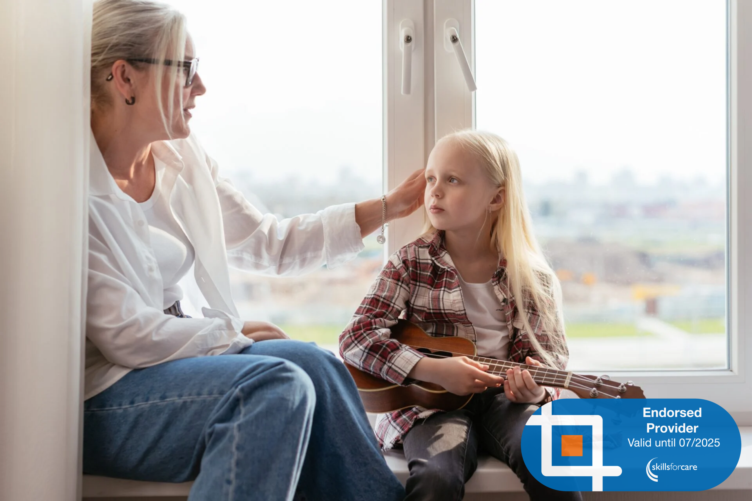 8 A woman stroking the hair of a small child with a ukelele. At the bottom right corner is the Skills For Care Endorsed Provider logo