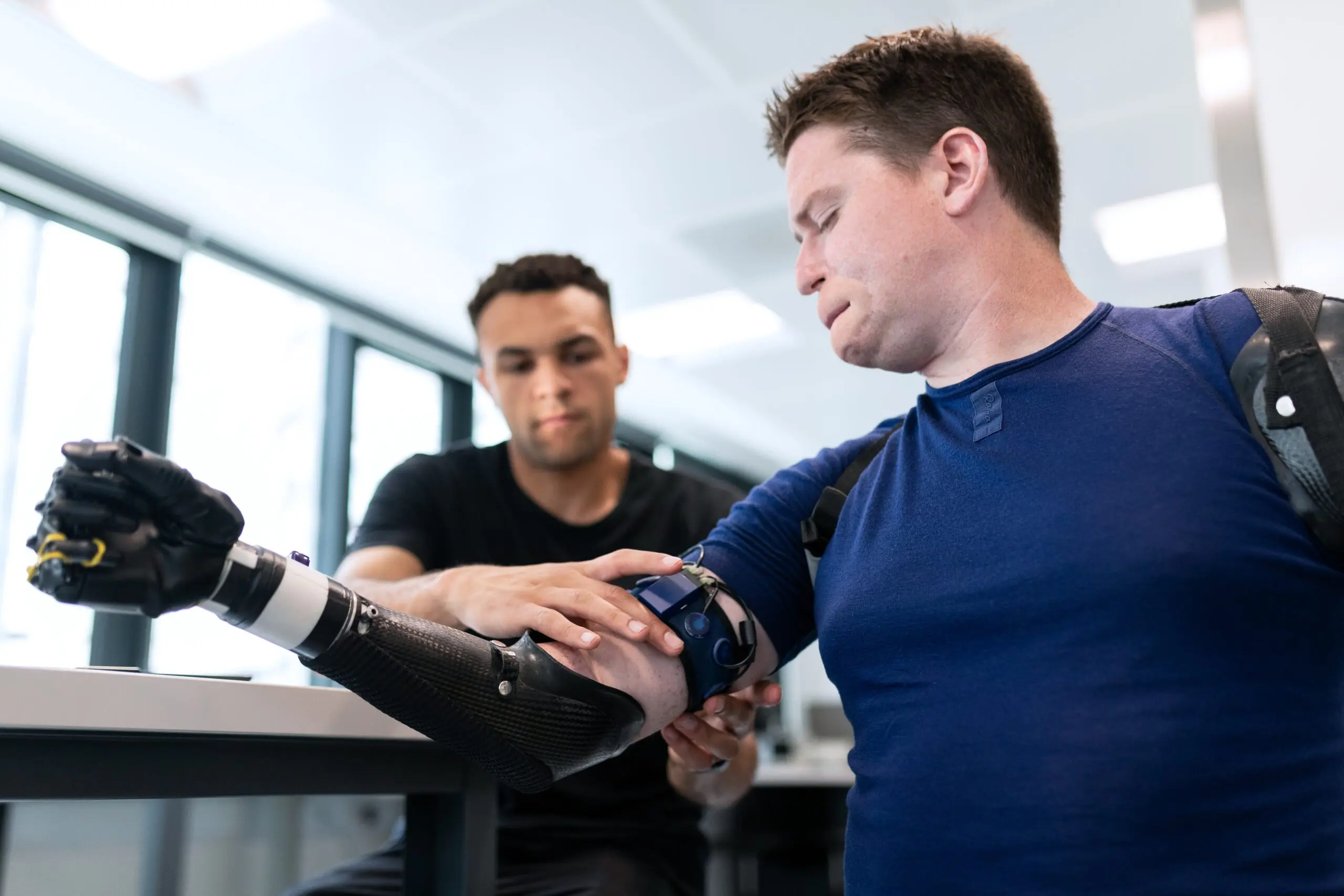 Someone having a bionic hand attached to them
