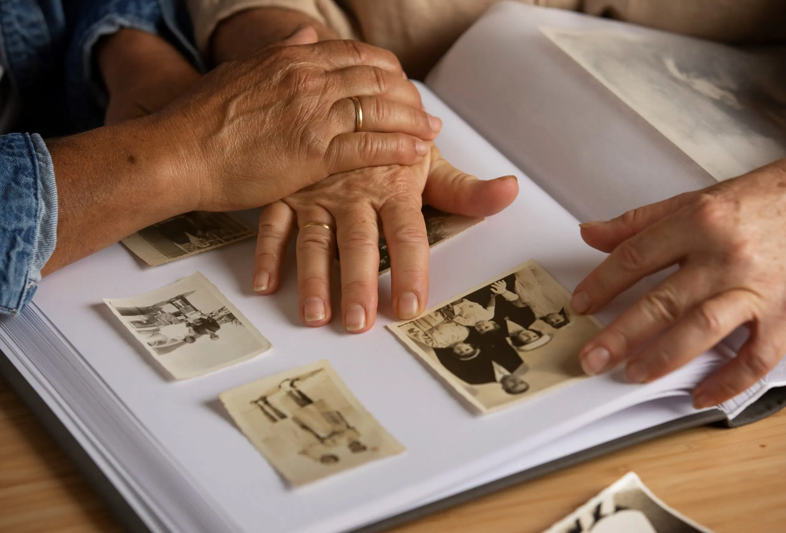 A person with dementia looking at a photo album