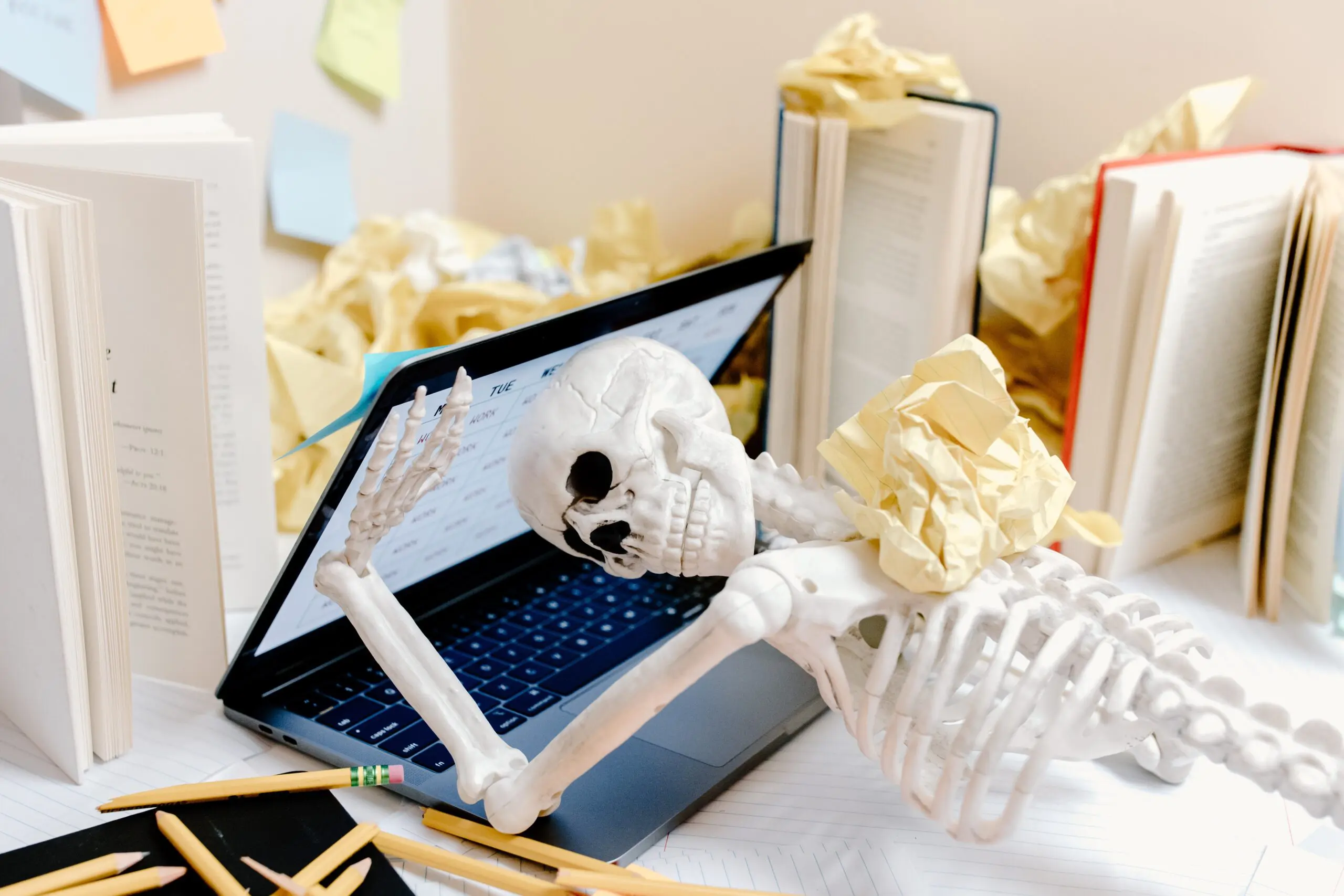 A burnout fake skeleton surrounded by workload