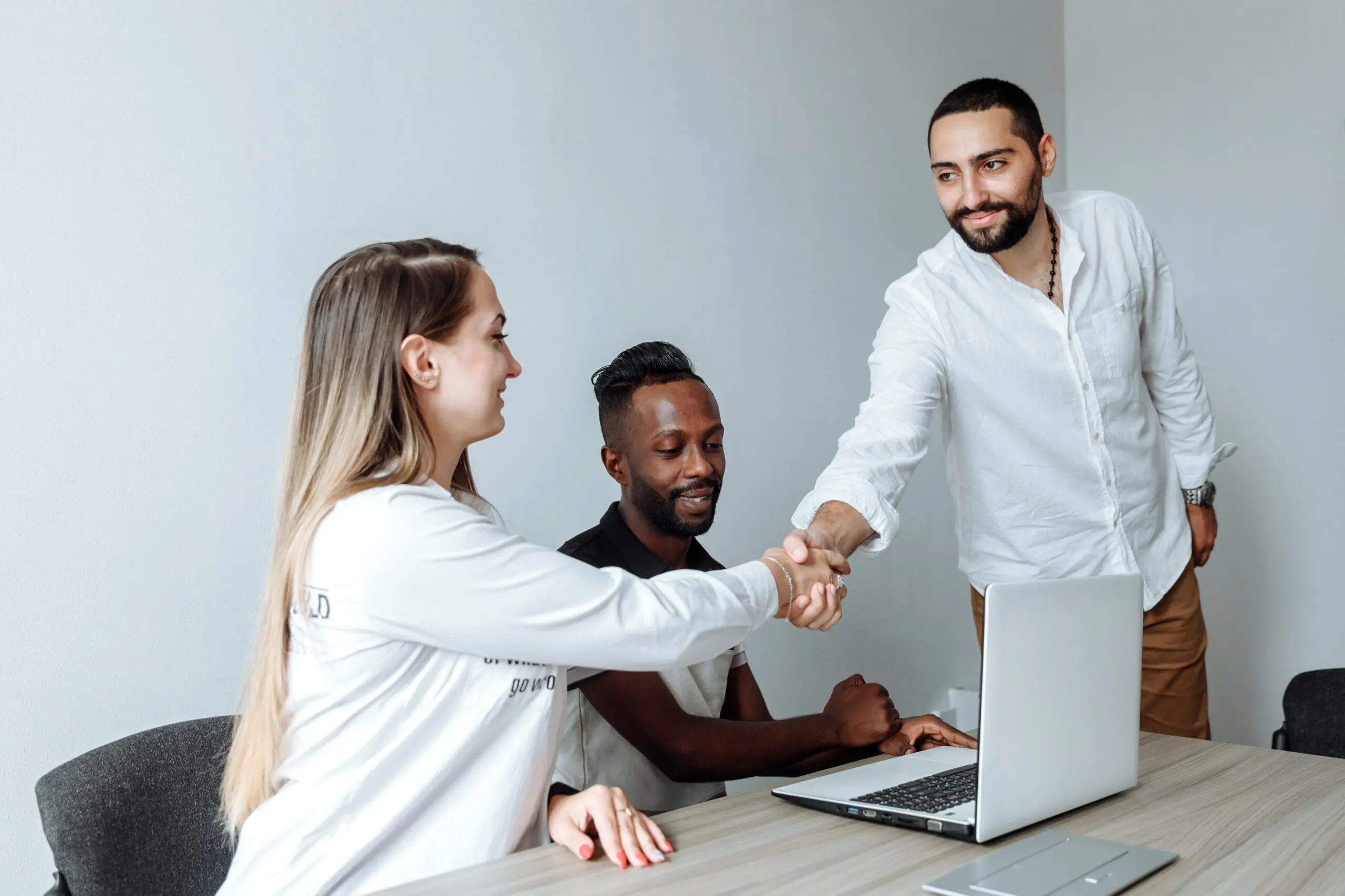 People dressed professionally shaking hands