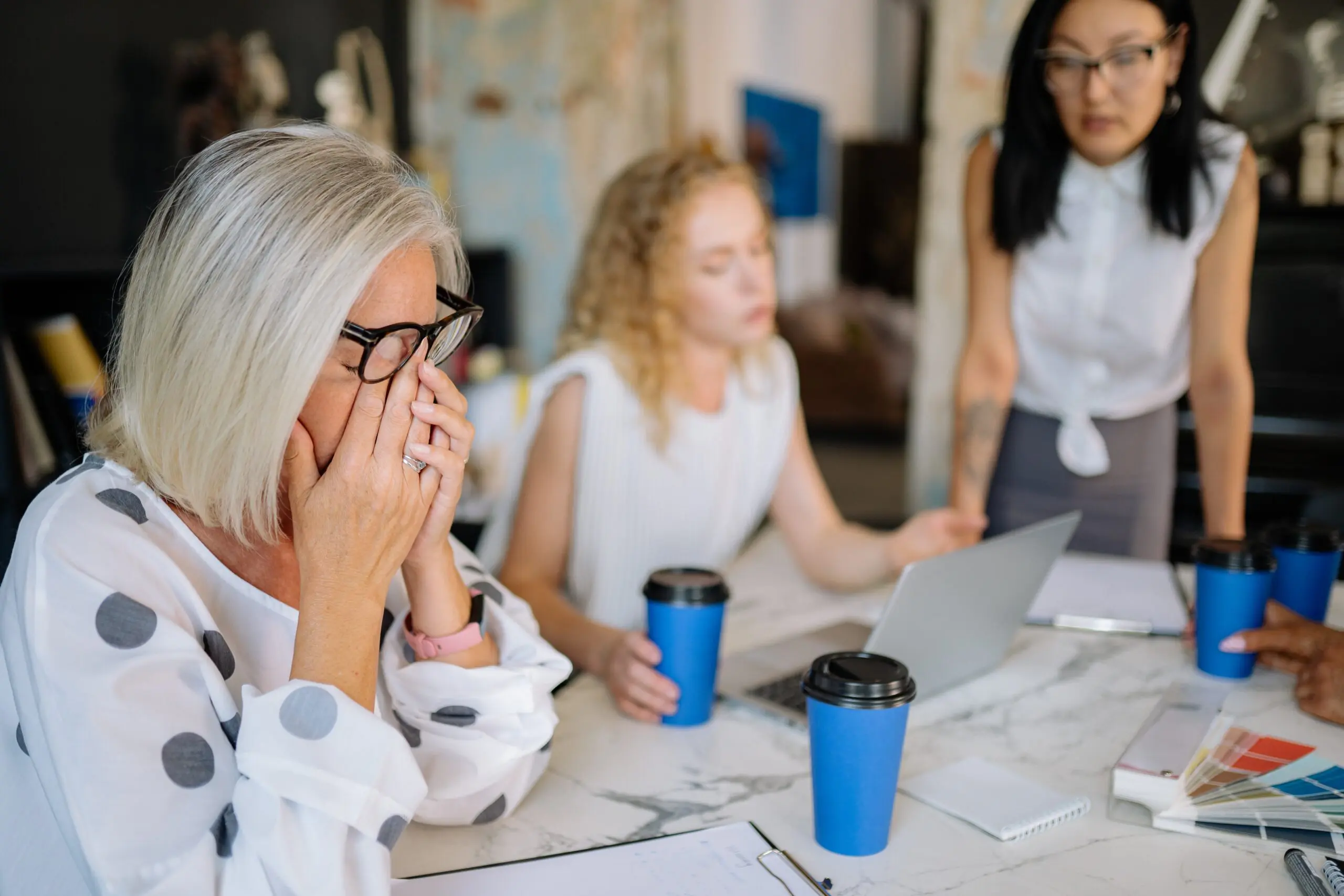 A woman stressed with conversation at work