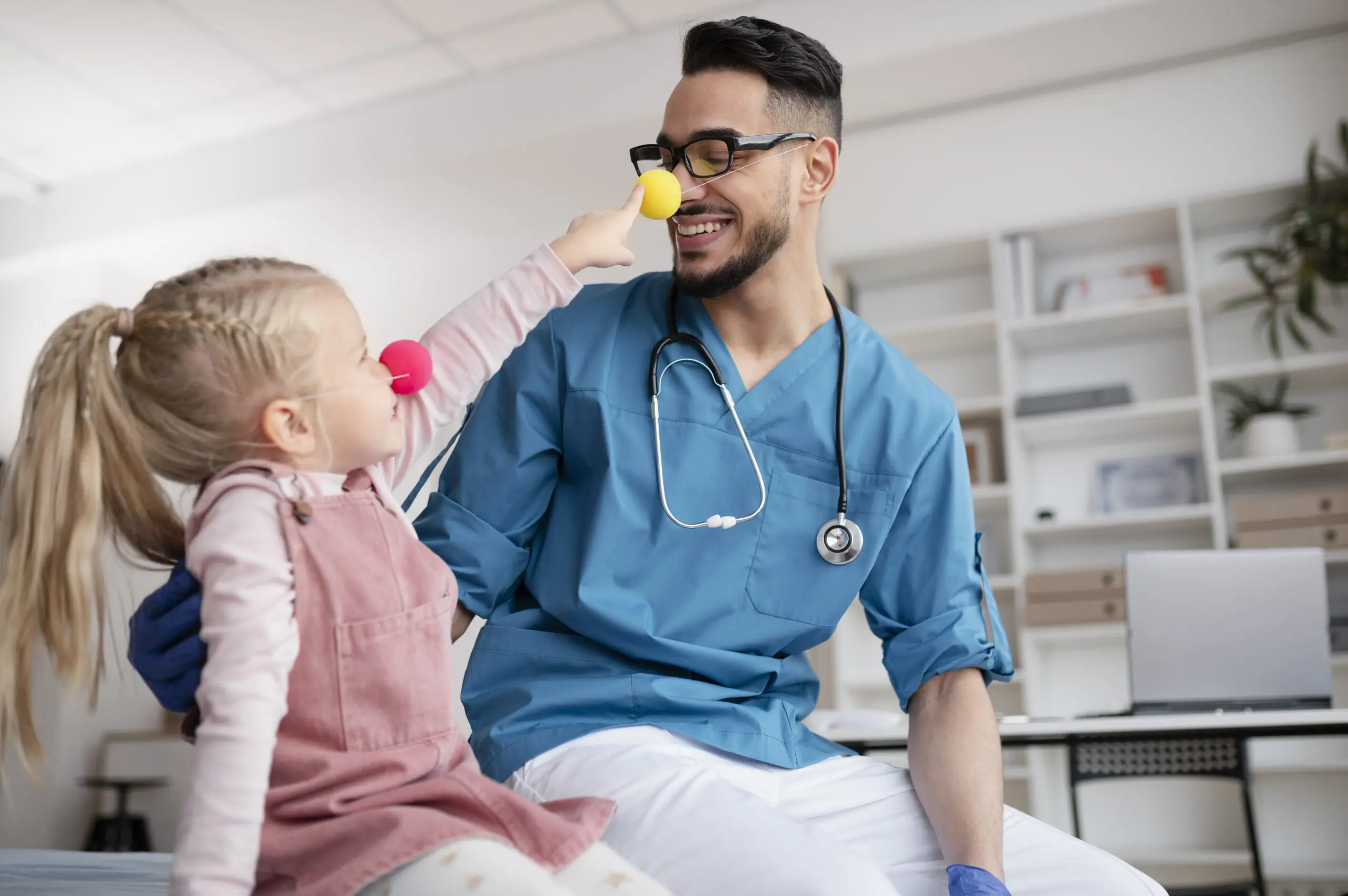 Health Care Assistant supporting a young girl