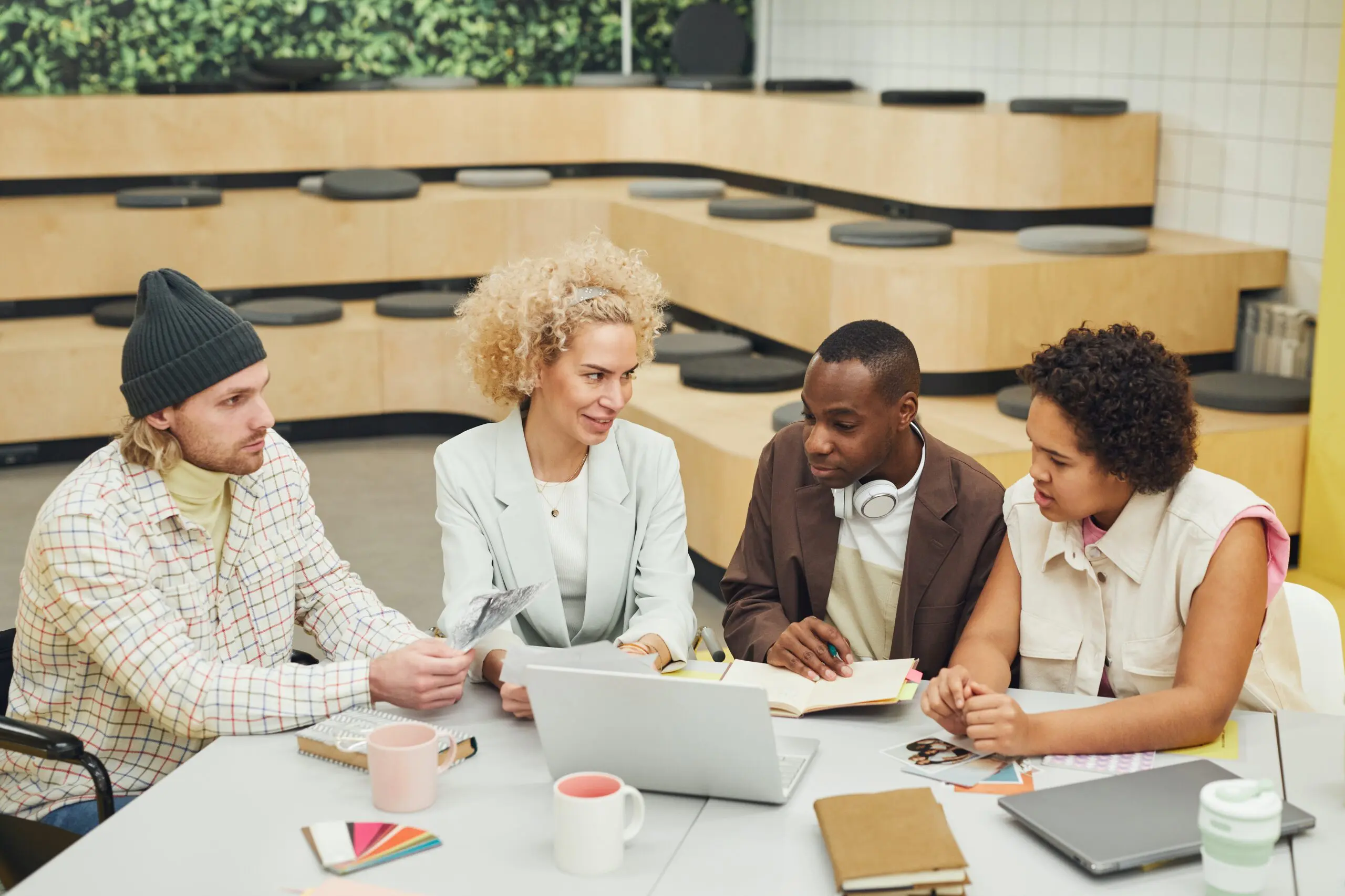 An image of four staff members working together