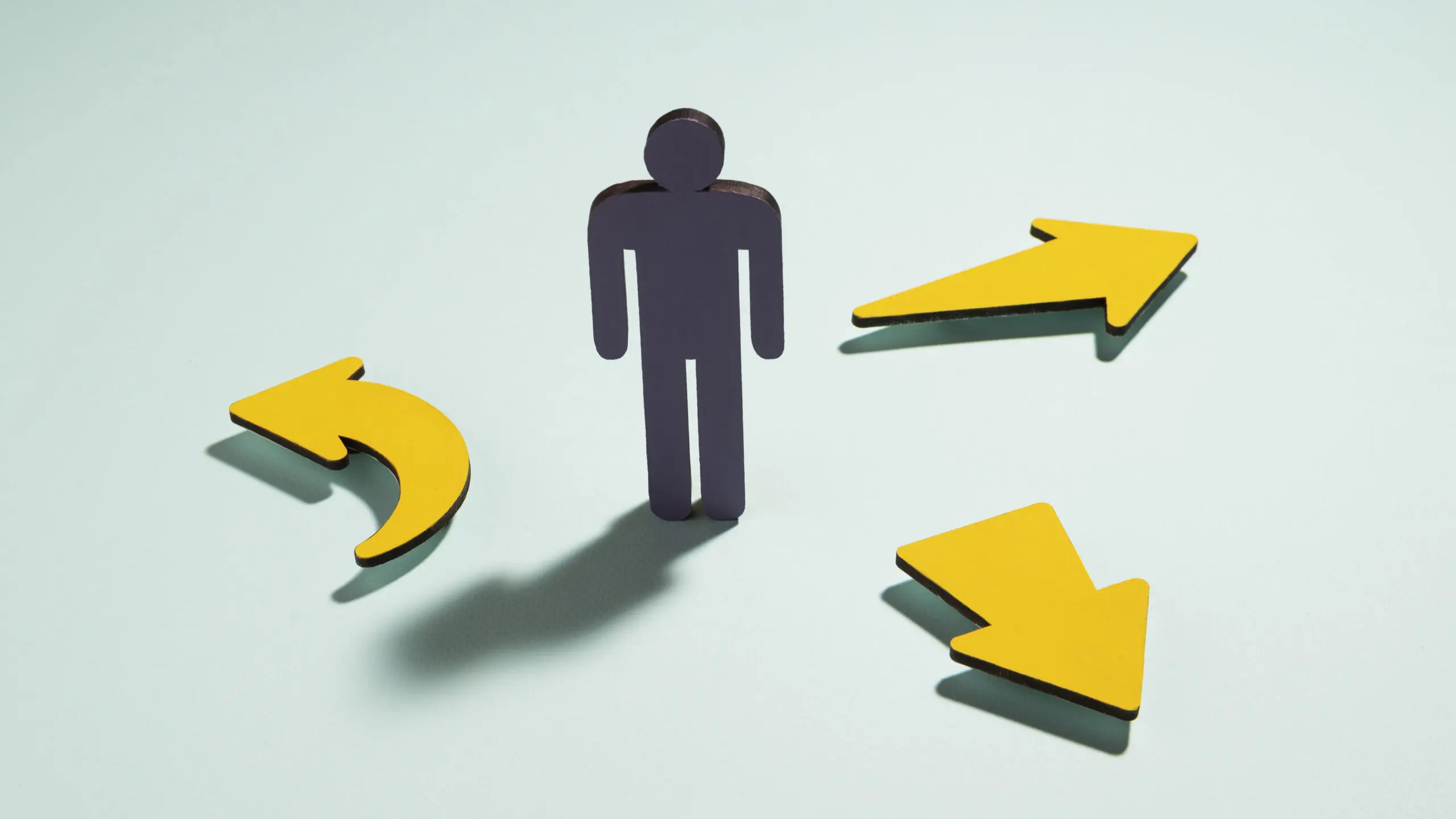 still-life-silhouette-of-a-man-surrounded-with-three-arrows-pointing-in-different-directions