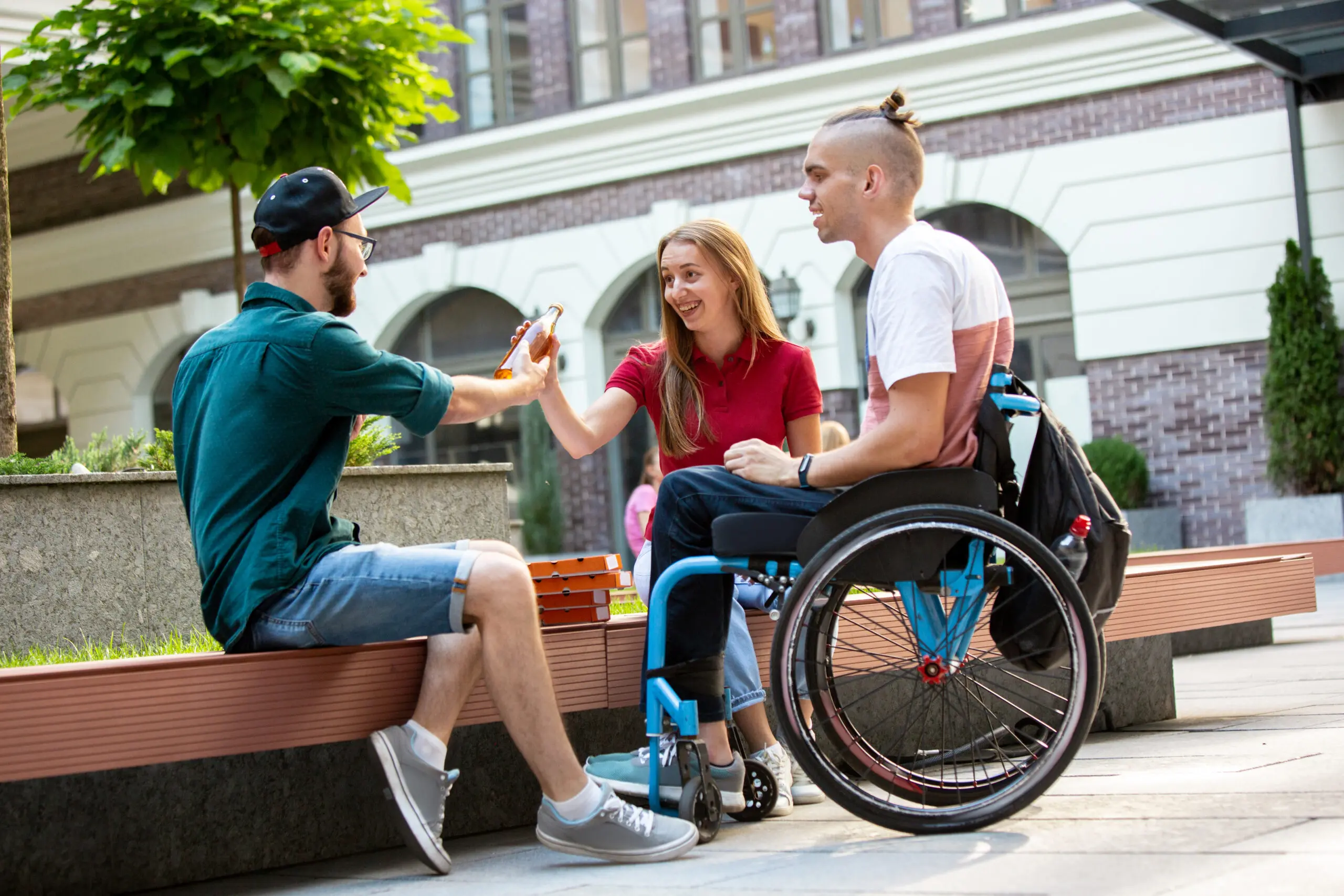 A-group-of-friends-encouraging-their-friend-in-a-wheelchair-to-take-the-promotion