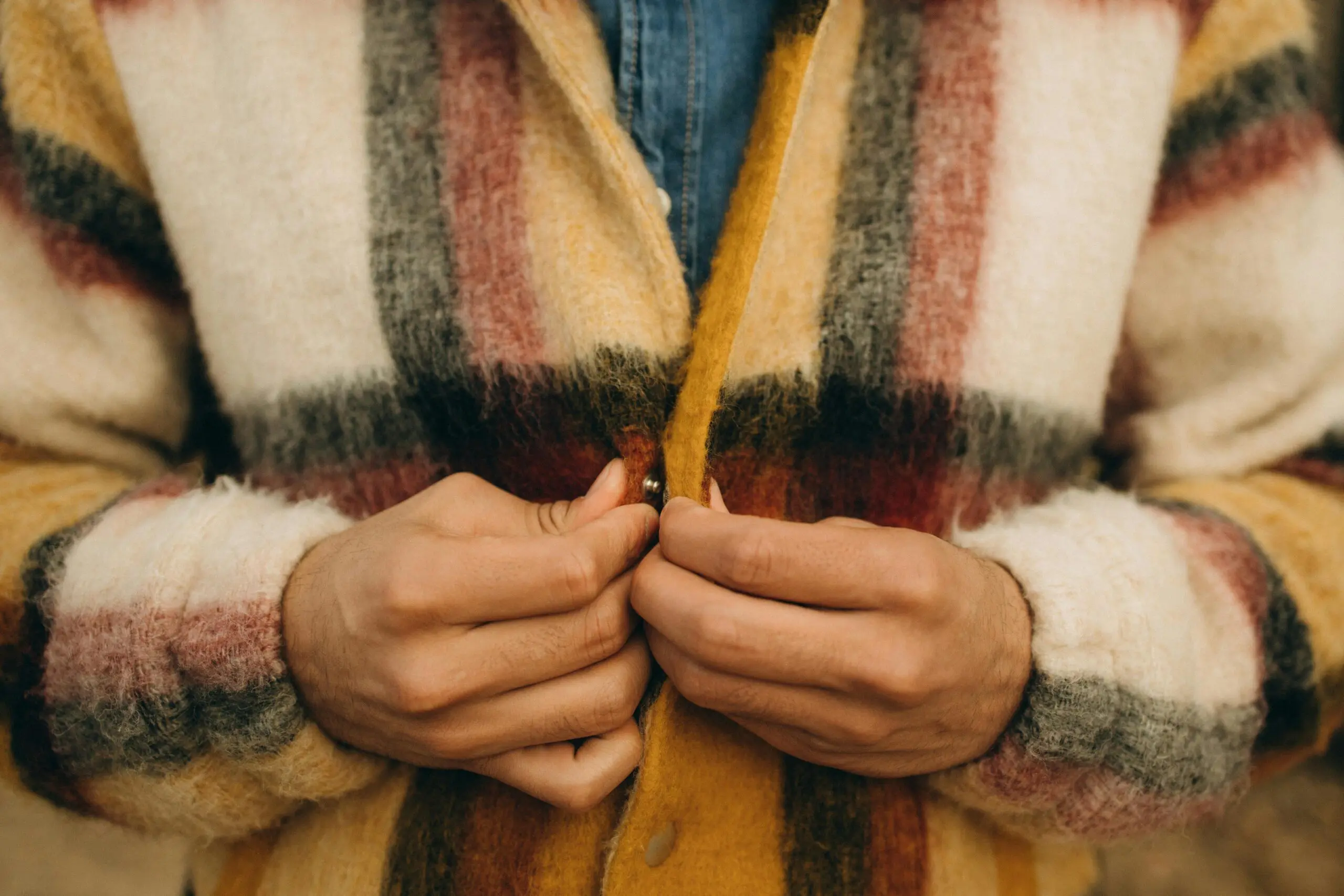 man-buttoning-up-his-jacket