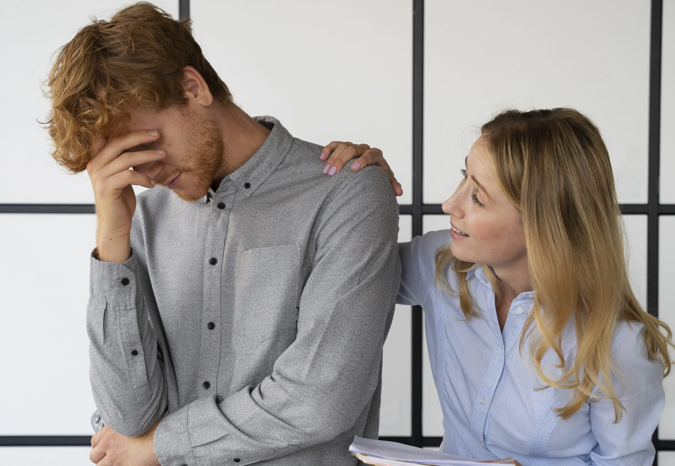 colleague-comforting-a-stressed-out-colleague-due-to-conflict