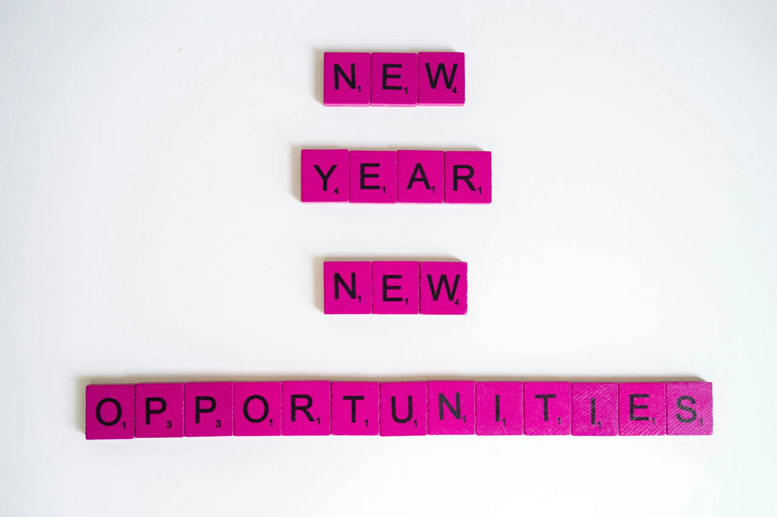 pink blocks spelling out the wording, new year new opportunities