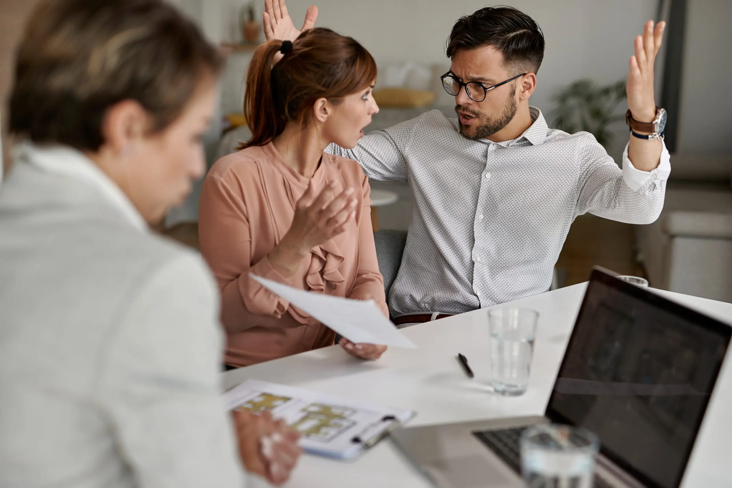 coworkers arguing while having a meeting