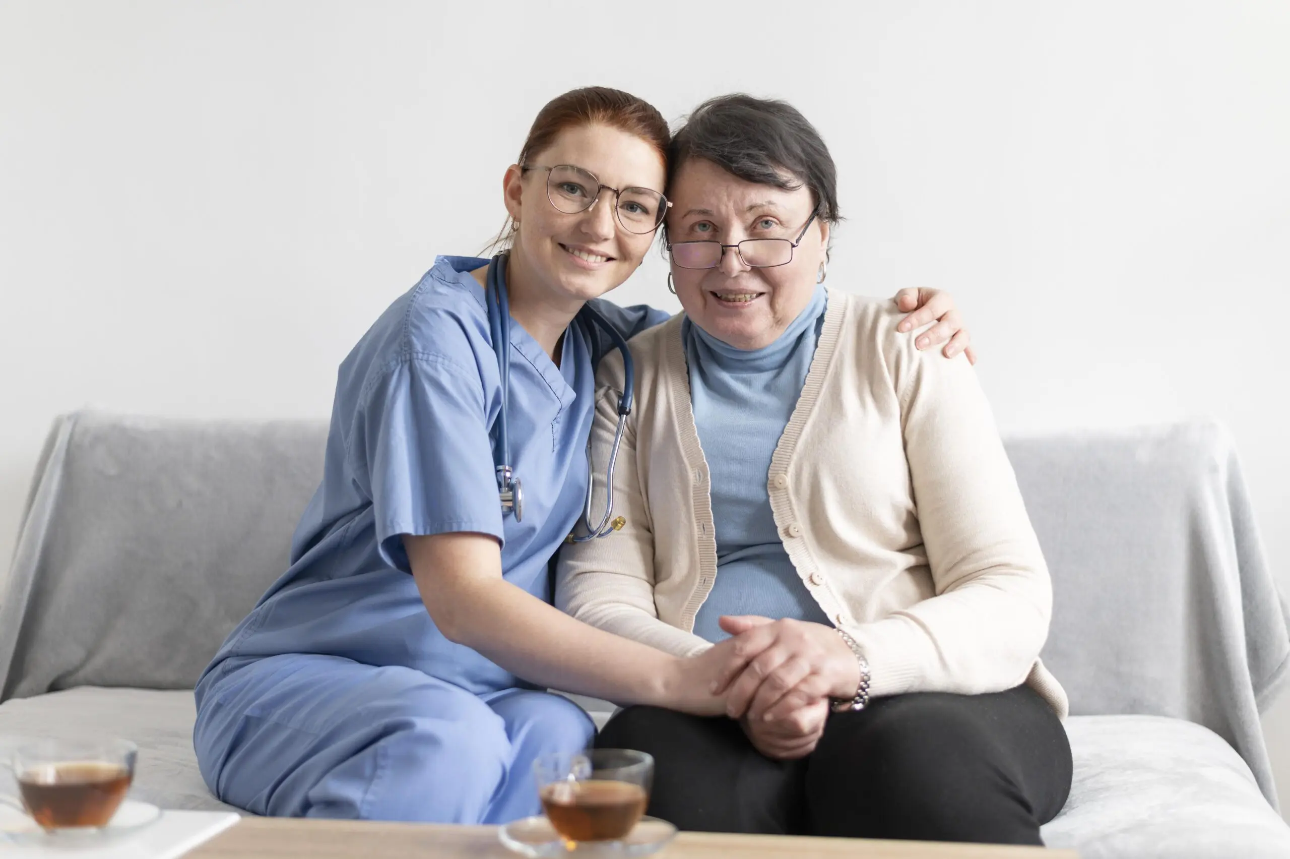 medium-shot-women-sitting-couch- with patient