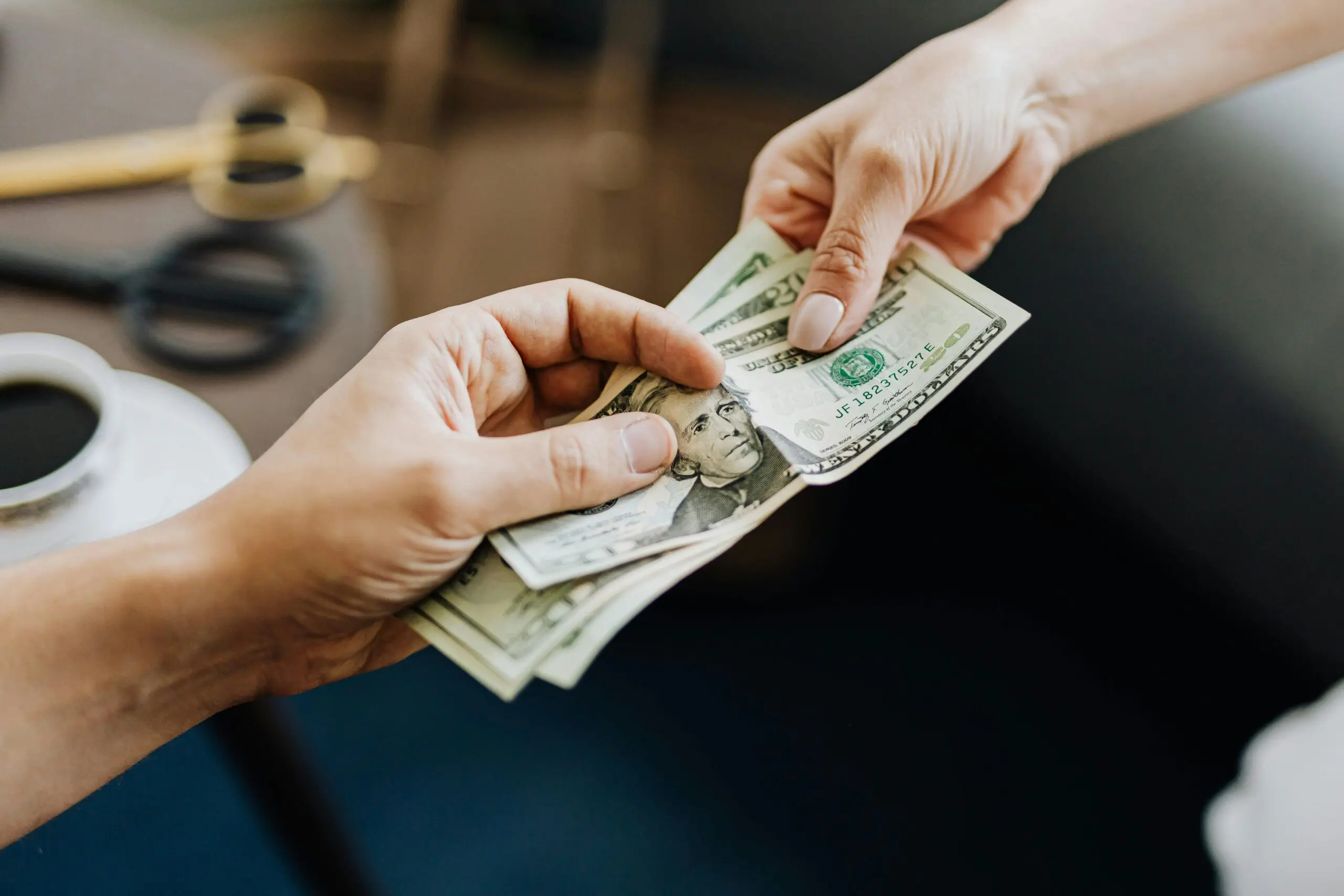 people handing over cash