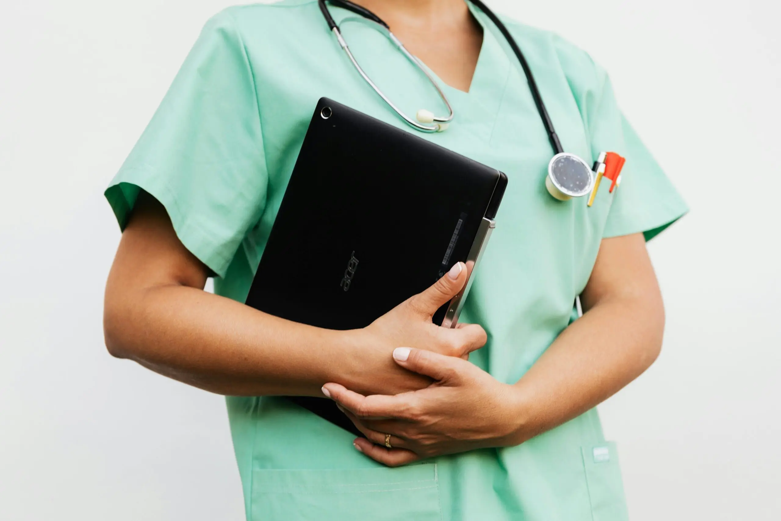 care worker wearing a cyan uniform