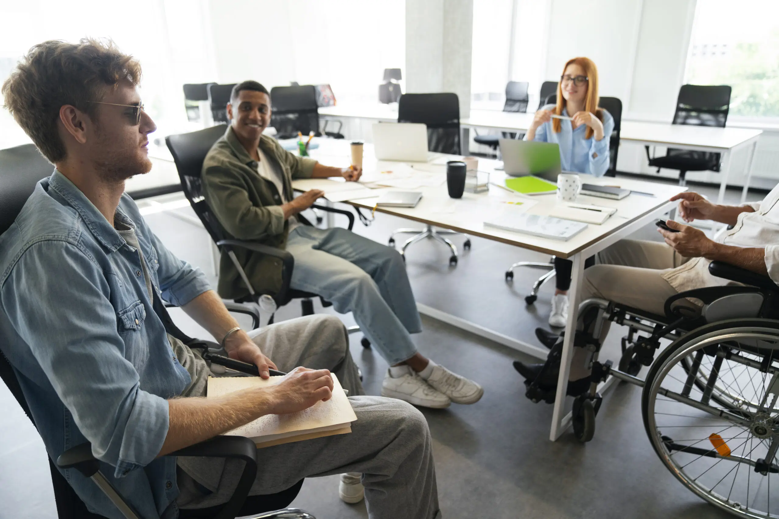 blind person presenting important meeting notes to the team using braille
