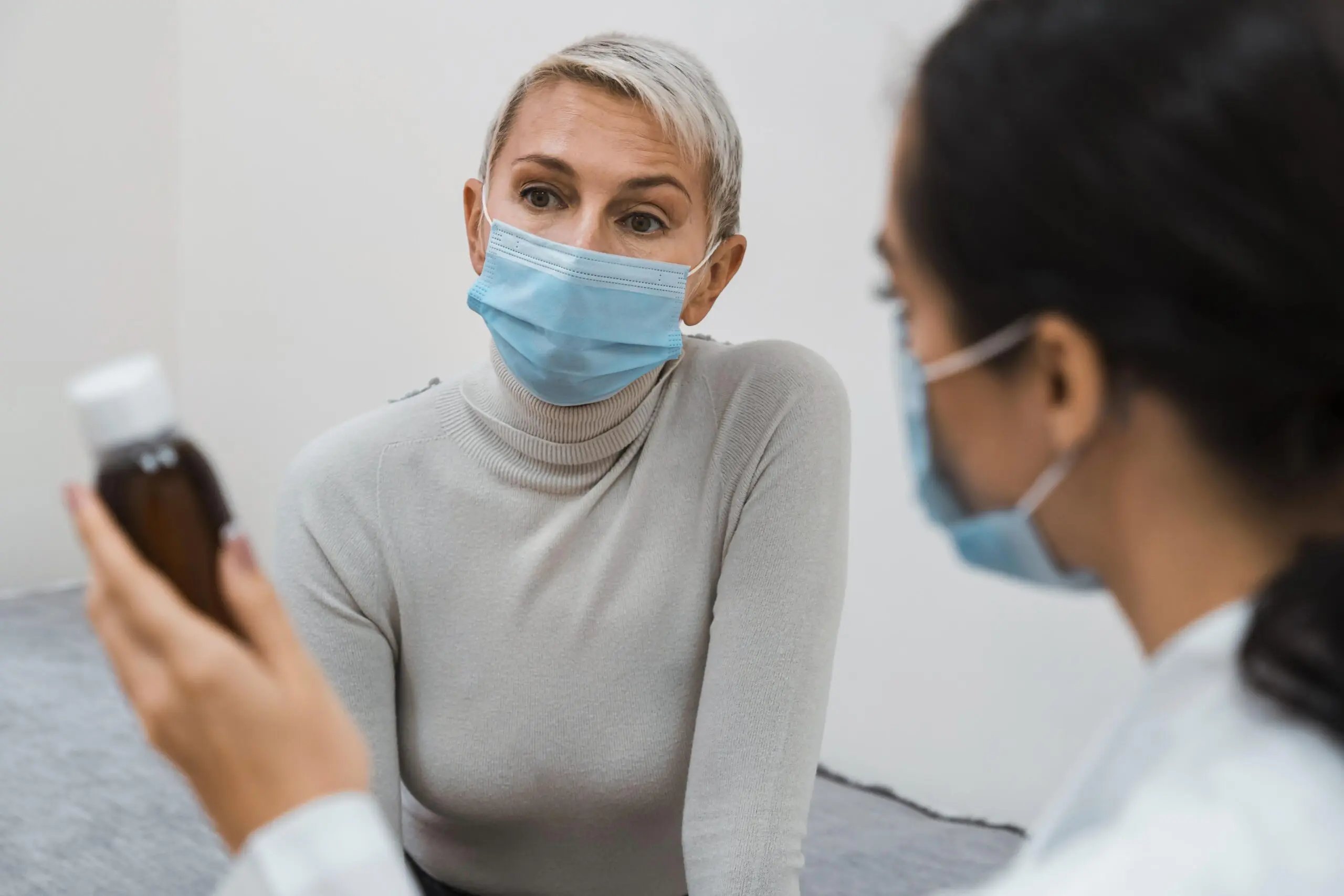 doctor-showing-bottle-medicine-to-patient-who-is-autistic-rather-than-helping-them