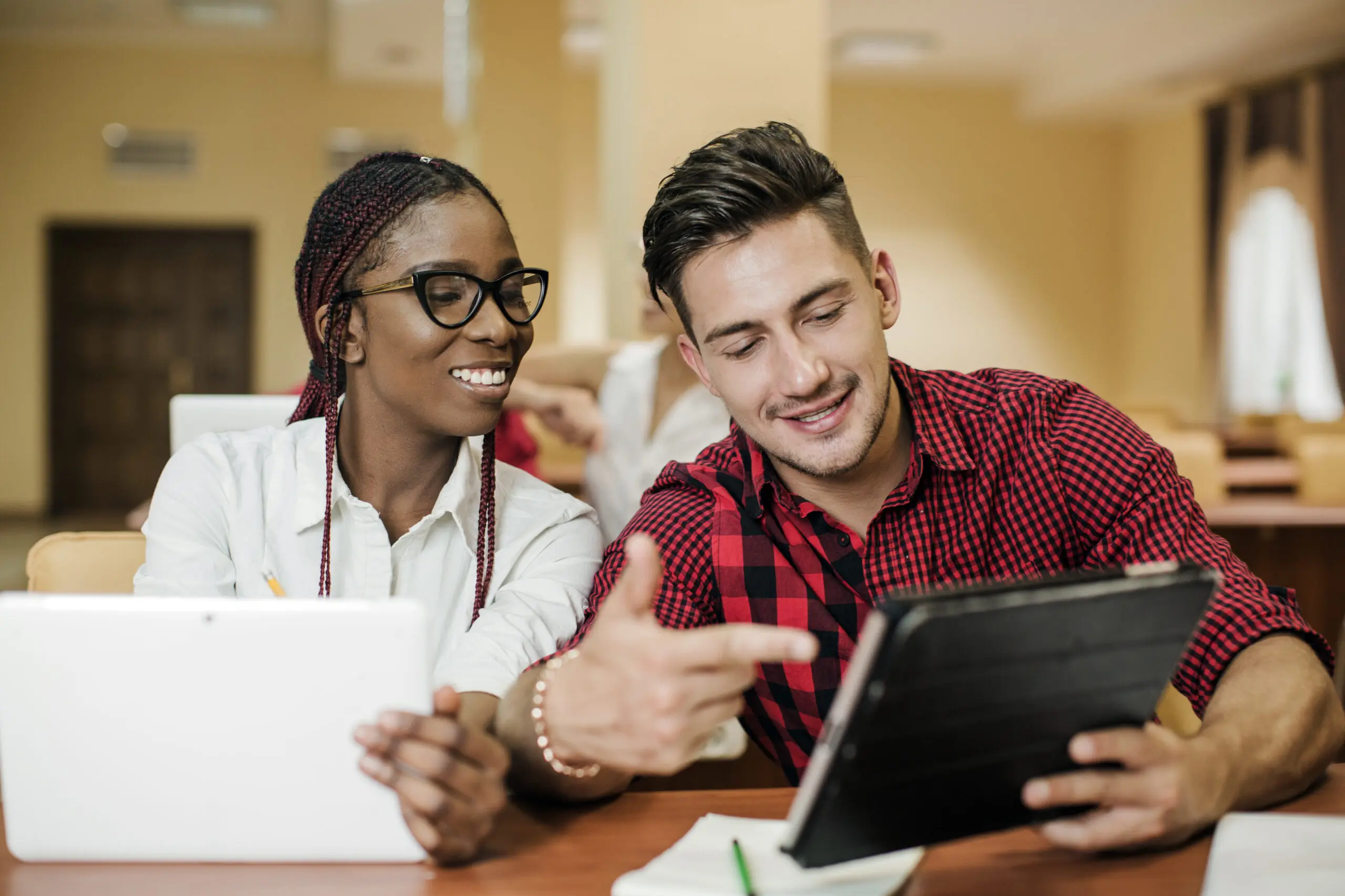 two colleagues completing eLearning courses with halo staffing