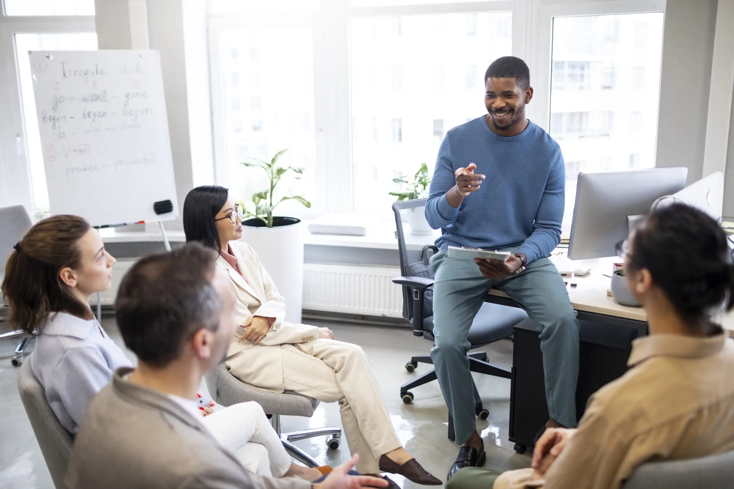black-man-presenting-training-to-a-group-of-adult-social-care-workers