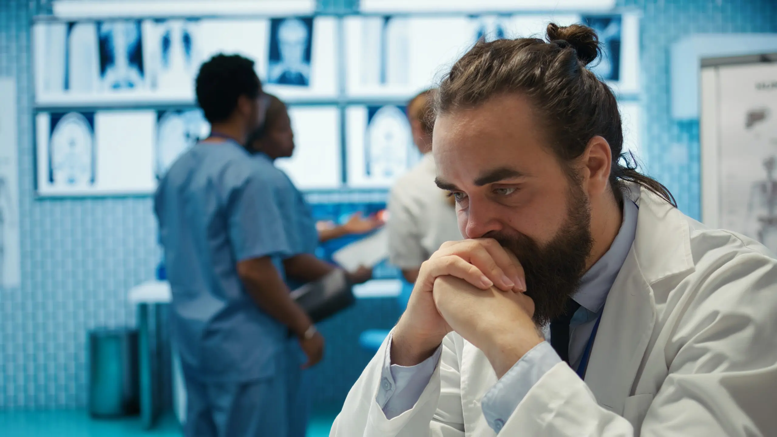 worried doctor facing barriers that his team can't see