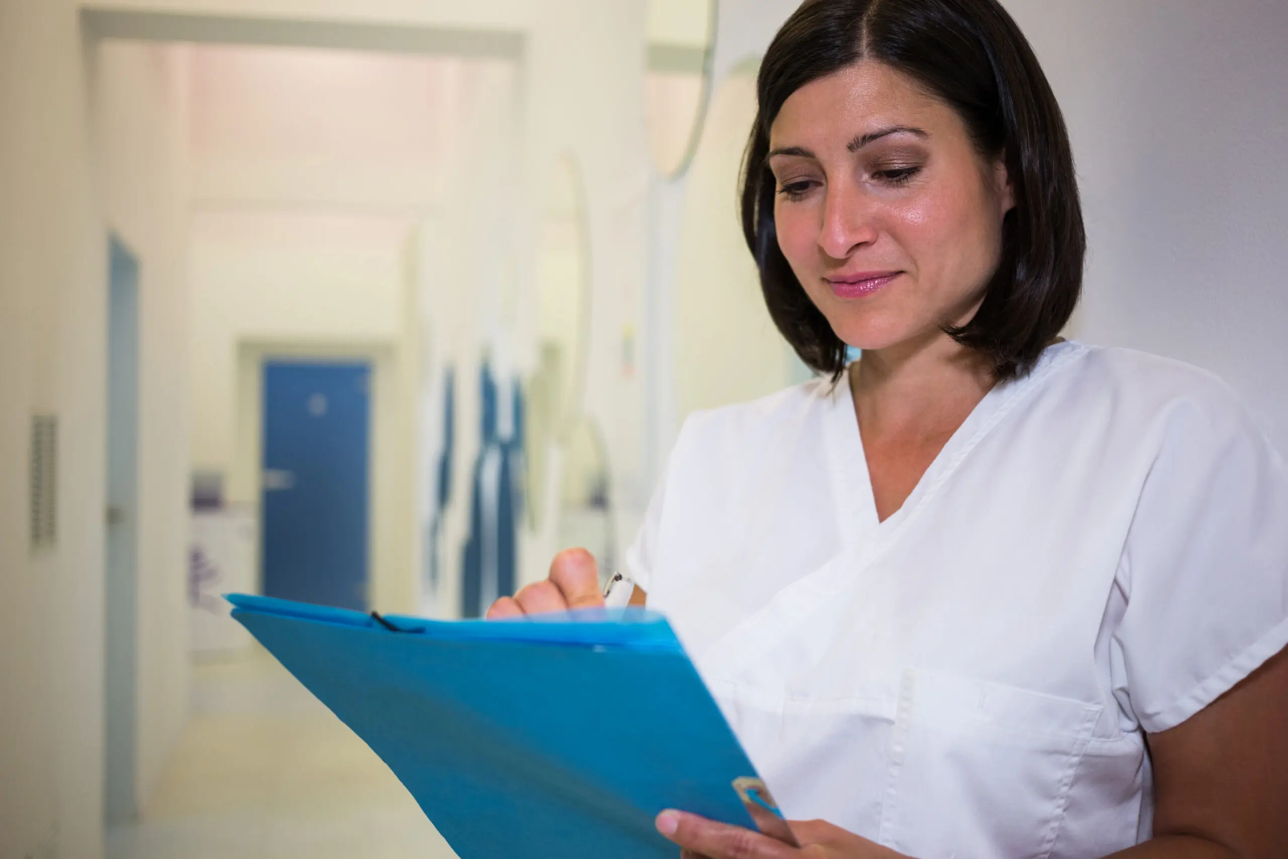 woman who has an invisible disability reading care notes