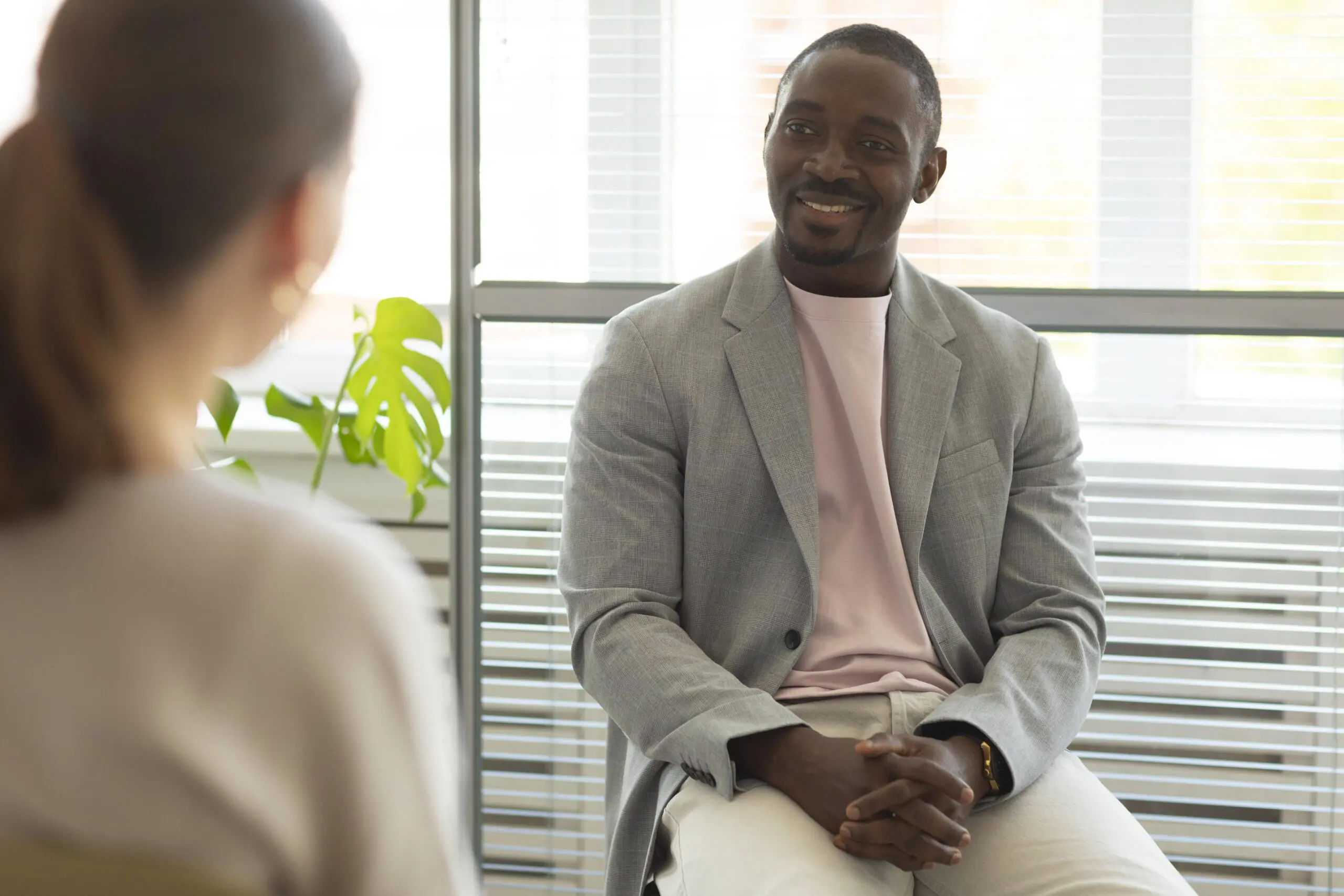 man-being-interviewed-indoors-by-recruiter