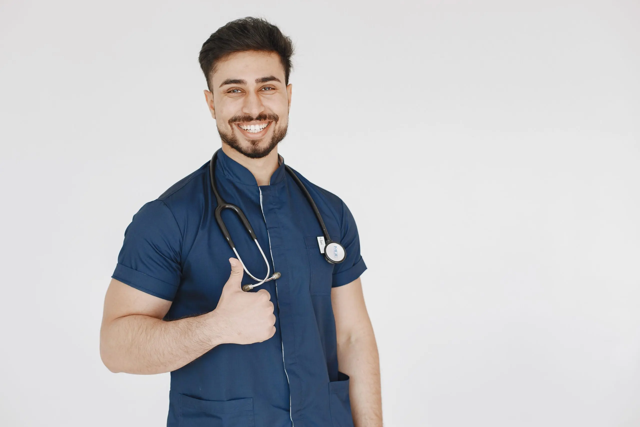 happy young man smiling with his thumbs up