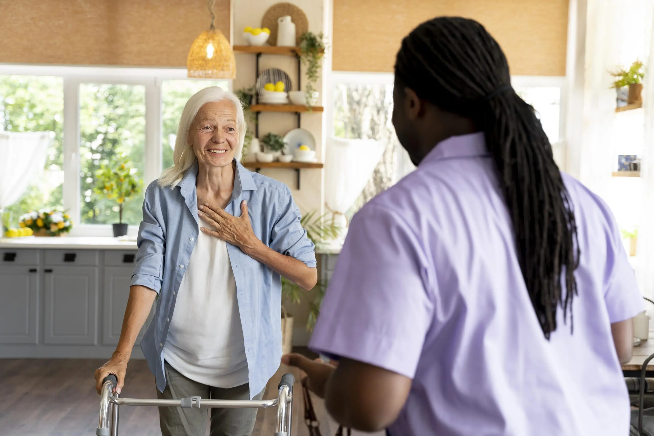african-social-worker-taking-care-senior-woman