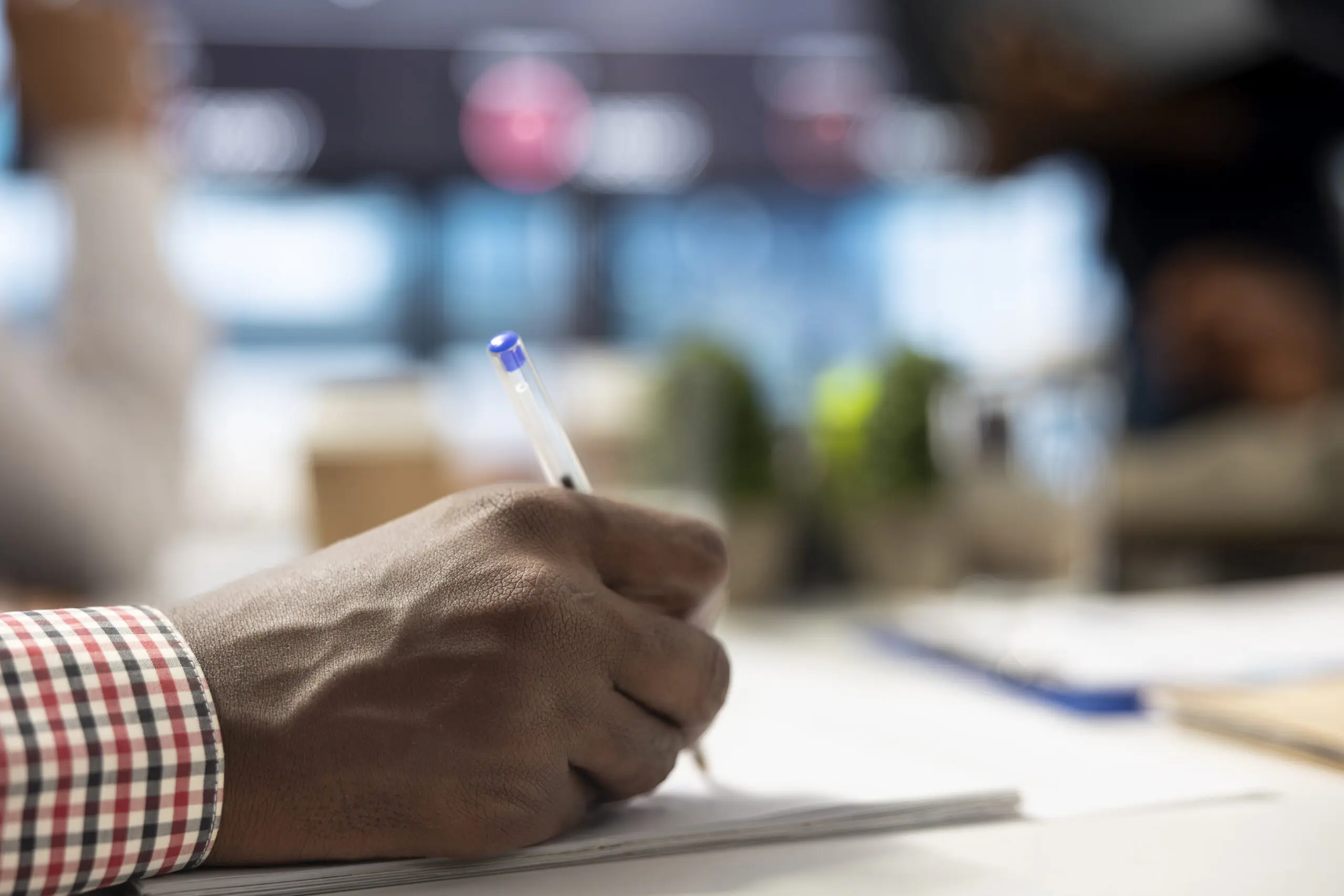 black care provider signing a document in relation to CQC changes