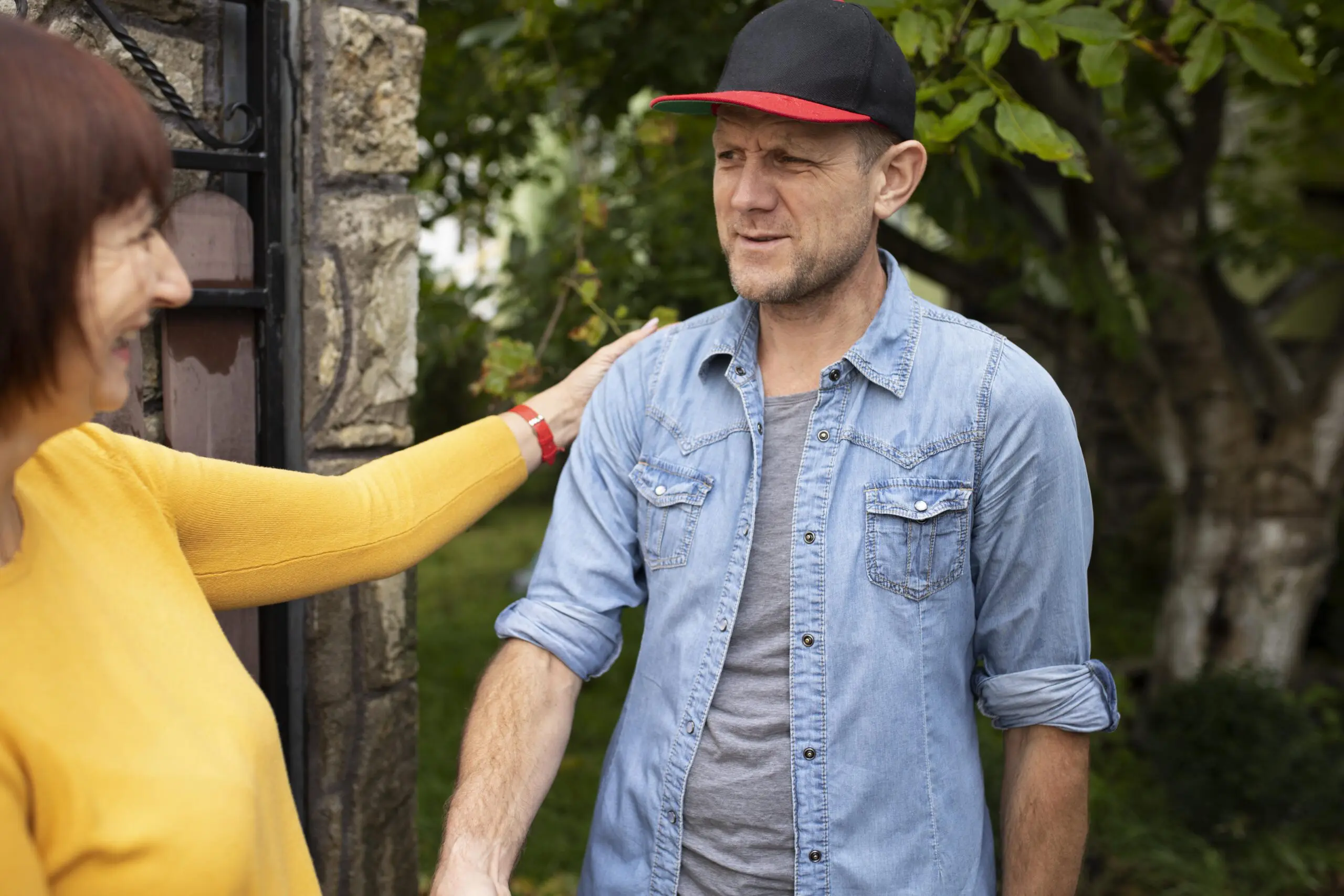 adult man with autism who is a support worker, shaking hands with a new patient