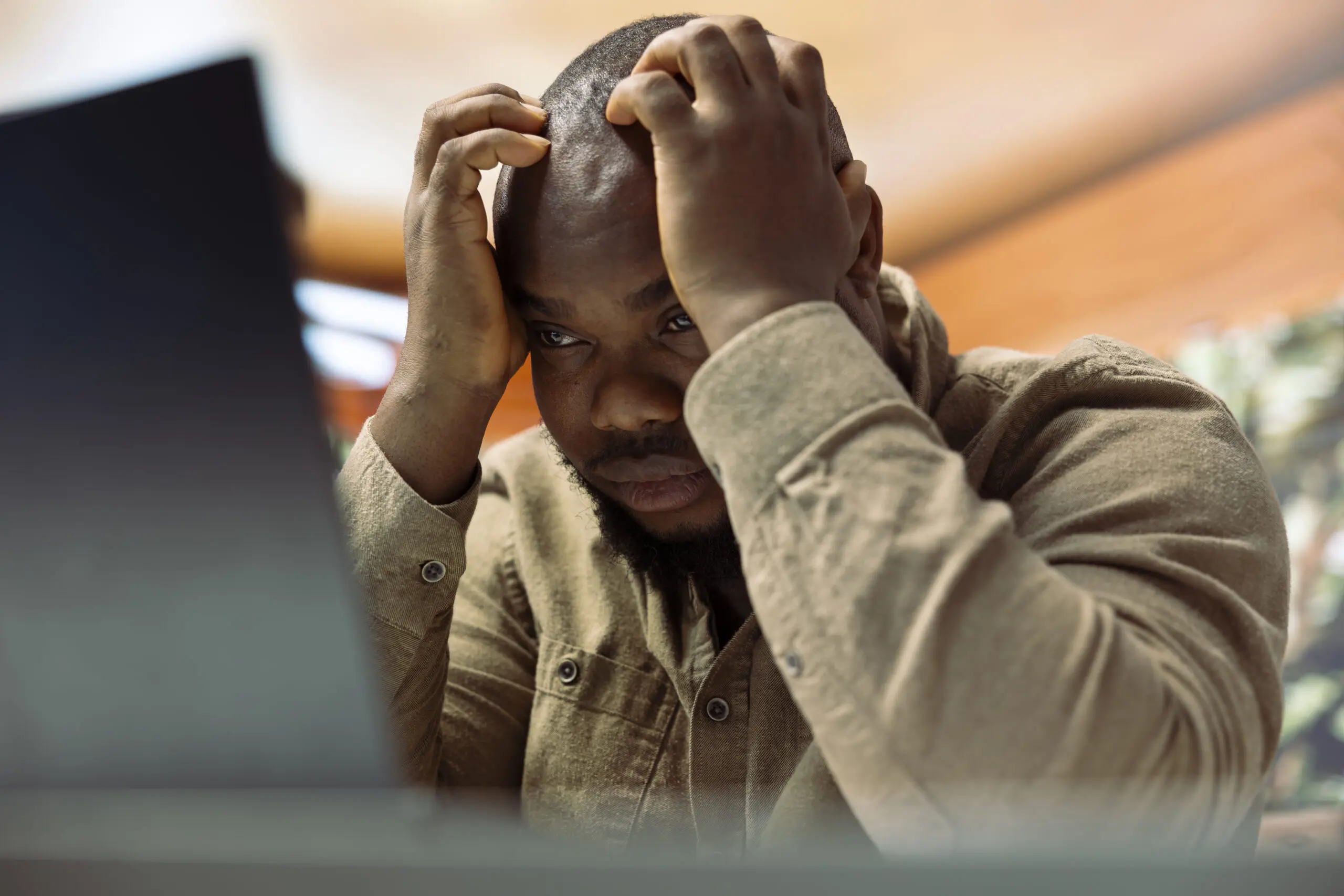 black man who is stressed and burnt out